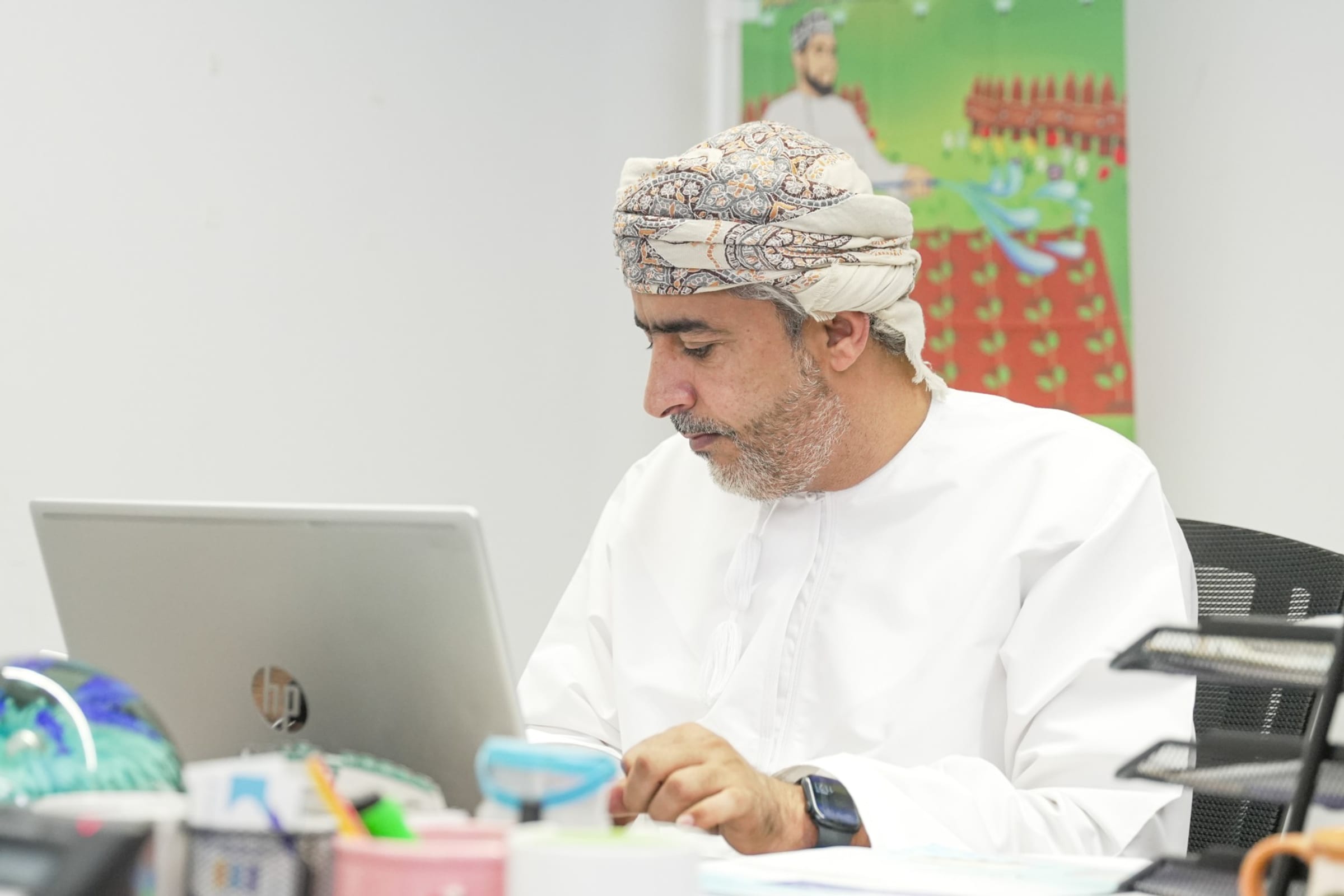 A colleague working at his laptop
